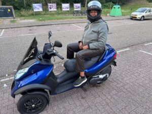 Shamna sitting on Blue Monster, the cobalt blue motorbike, during the week of Ekagrata